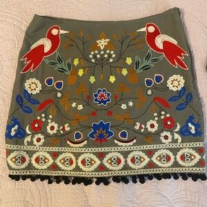 Bohemian Linen Mini Skirt Small Embroidered
Green Embroidered
Birds Pom Pom Trim